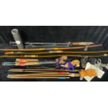 A Japanese Kyudo bow, cloth pouch; another similar; another English longbow; assorted arrows,