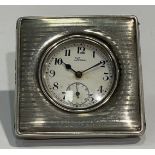 A silver square miniature clock, Arabic numerals on white enamel dial, subsidiary seconds, 6cm x