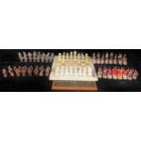 An onyx chess board and chess set, 31.5cm square; a, Battle of Waterloo chess set; another, stylised