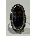 A Blue John marcasite and silver coloured metal ring, large elongate oval tablet within a band of