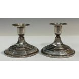 A pair of Art Deco Continental silver candlesticks, stepped bases, 8.5cm high, marked 830