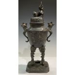 A 19th century Chinese patinated brass koro and cover, temple lion to cover, 41cm high