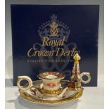 A Royal Crown Derby Imari 1128 pattern chamber stick and candle snuffer, 15cm wide, first quality,