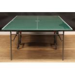 A Kettler table tennis table, 75.5cm high, 275cm long, 152.5cm wide; rackets ***This lot is held