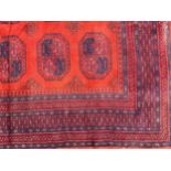 An Afghan wool rug or carpet, 228cm x 170cm