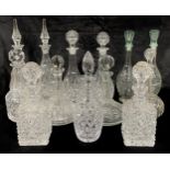 A cut glass ship's decanter, assorted others, a pair of press moulded glass decanters, qty (13)