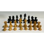 A Staunton type boxwood and ebonised chess set, wooden box with sliding cover