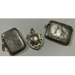 An Edward VII silver vesta case, chased and engraved with flower heads, monogrammed cartouche,