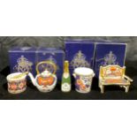 A Royal Crown Derby miniature champagne bottle and ice bucket, first quality, boxed; others, drum