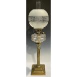 A late 19th century oil lamp, brass Corinthian column support, faceted clear glass reservoir, Hink's