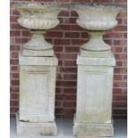 A near pair of concrete garden urns and plinths, 125cm high overall, the top 55cm diameter (2)