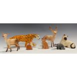 A Beswick model, of a leopard, 29cm long; a Beswick model of a stag, 20.5cm high; another, Doe;