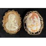 A large Victorian cameo brooch, carved with courting couple, 7cm high; another cameo type brooch (2)