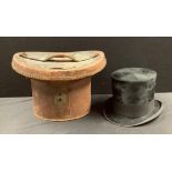 A moleskin top hat, 20cm x 16cm interior, 16cm high, in a brown leather top hat box