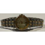 A lady's Gucci fashion watch, two tone stainless steel, baton indicators, integral bracelet strap