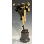 An Art Deco bronze sculpture, of a dancing lady of fashion, stepped circular composite marble