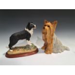 A Beswick fireside model, of a Yorkshire Terrier, seated with ribbon, 26cm high, impressed mark,