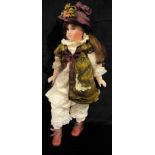 Toys & Juvenalia - a reproduction bisque head and painted composition bodied doll, the bisque head