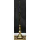 Interior Design - a parcel-dezincified brass telescopic floor lamp, circular base, bracket feet,