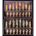 A Studio Anne Carlton resin chess set, The History of Golf, the tallest piece 13cm high, boxed
