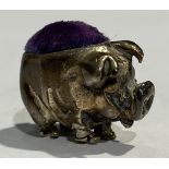 An Elizabeth II silver novelty miniature pincushion, modelled as a pig, 2.5cm wide, Ari D Norman,