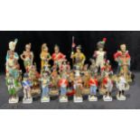 A collection of porcelain and plastic military figures, European and British historical regiments,