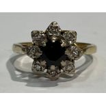 An 18ct gold sapphire and diamond cluster ring, size K, marked 750, 3.7g