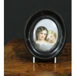 A 19th century Continental porcelain oval plaque, painted with a pair of children, 8cm x 6cm