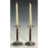 A pair of George V silver mounted oak barley twist candlesticks, 14cm, Birmingham 1918