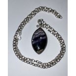 A double sided navette shaped Blue john pendant, of good colour, the silver coloure dmetal mount