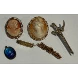 A late 19th century rose gold bar brooch, unmarked, 3g; a 9ct gold mounted cameo brooch/pendant,