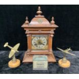 Boxes & Objects - a Junghans oak architectural mantel clock; a pair of brass desk weights, each as a