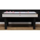 A BCE air hockey table, power cable severed, 81cm high, 190cm long, 91.5cm wide; four strikers;