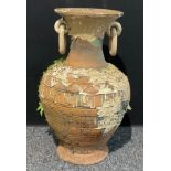 An Etruscan Revival style terracotta garden urn, loop handles