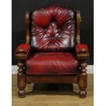 An Arts & Crafts style oak lambing inspired chair, 99cm high, 83cm wide, the seat 55cm wide and 57cm