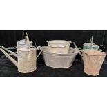A rivetted galvanised steel bucket; others; galvanised steel watering cans; a two handled wash basin