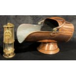 A brass miner's lamp, Eccles, Protector Lamp, swing handle; a copper coal scuttle, swing handle (2)