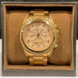 A Michael Kors watch, boxed
