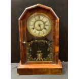 A late 19th century American mantel clock, Roman numerals, twin winding holes, glazed door