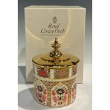 A Royal Crown Derby Imari 1128 pattern cylindrical preserve pot, gilt metal cover with finial, 10.