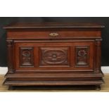 A late 17th/early 18th century Continental oak chest, hinged top above a three panel front, carved