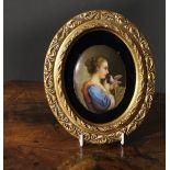 A 19th century Continental porcelain oval plaque, painted in polychrome with a young girl and a