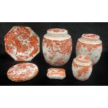 A set of three Royal Crown Derby Red Aves pattern graduated ovoid Ginger Jars and covers, 21cm, 18cm