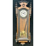 A Vienna wall clock, white enamel dial, Roman numerals, twin winding holes, pendulum, weight,