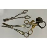 A pair of plated grape shears; another; an egg topper (3)