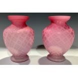 A pair of Victorian pink satin glass ovoid pedestal vases, lattice pattern, 15cm