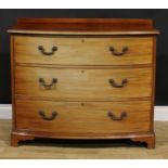 An early 20th century mahogany bowfront chest, of three long drawers, 87cm high, 103.5cm wide,