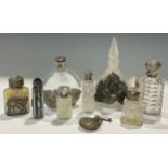 A Victorian silver mounted clear glass smelling salts bottle, Birmingham 1898, 7.5cm; another