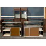 A suite of polished aluminium and brown painted shop fitting display cabinets, comprising four