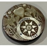 A 19th century silver and mother of pearl compact, carved with Bethlemem Star, doves and heart,